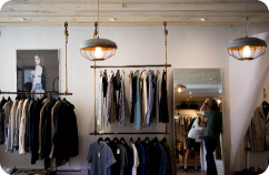 Image of various clothes in a store.