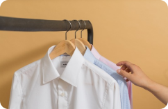 Image of shirts on a clothes rack.